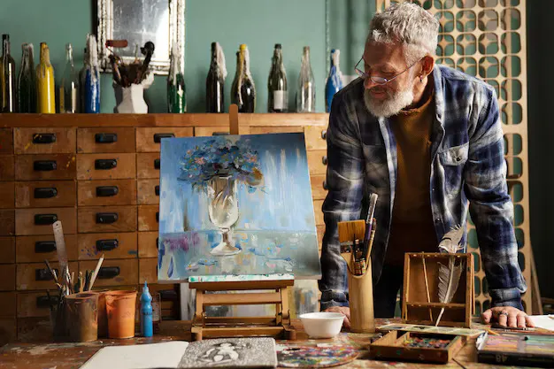 Painter at work on a canvas in a studio